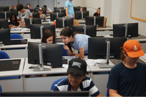 Groups of teens in a computer lab.
