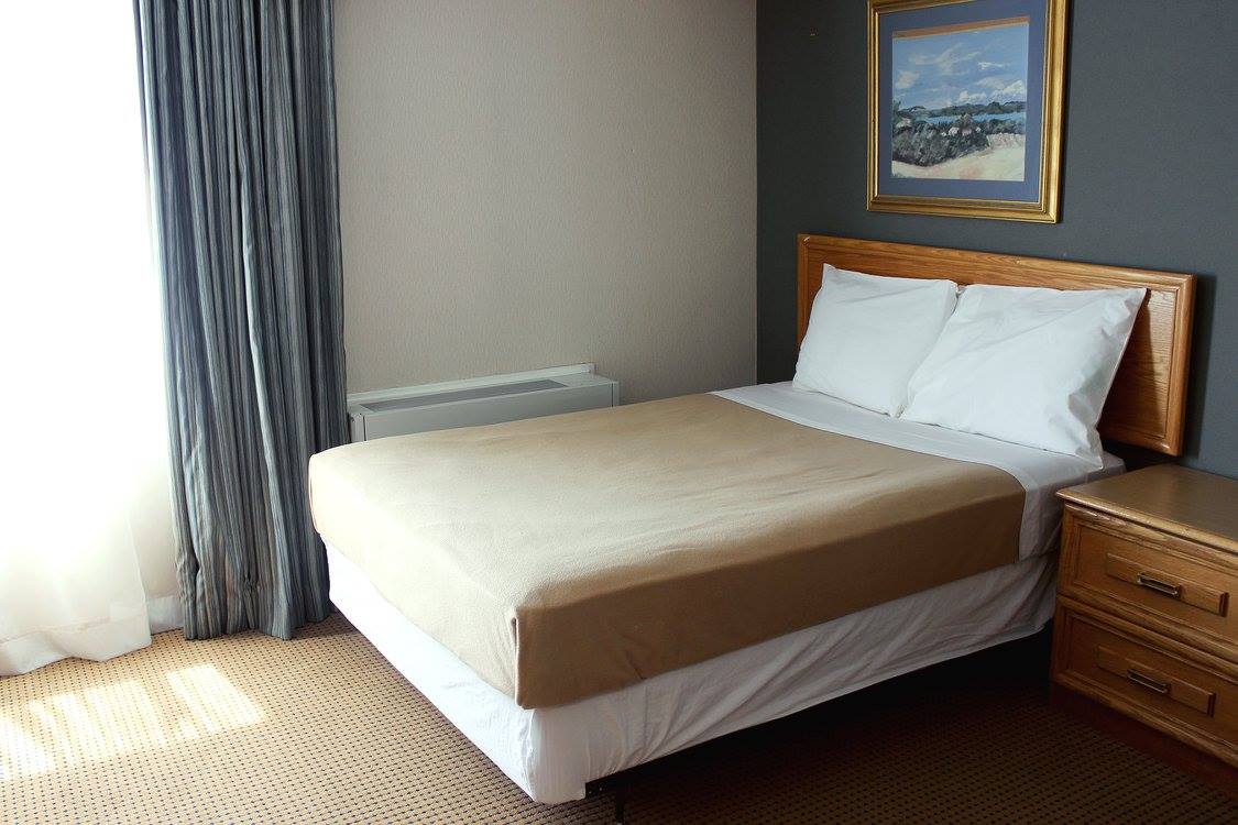 Double bed in rideau residence room.