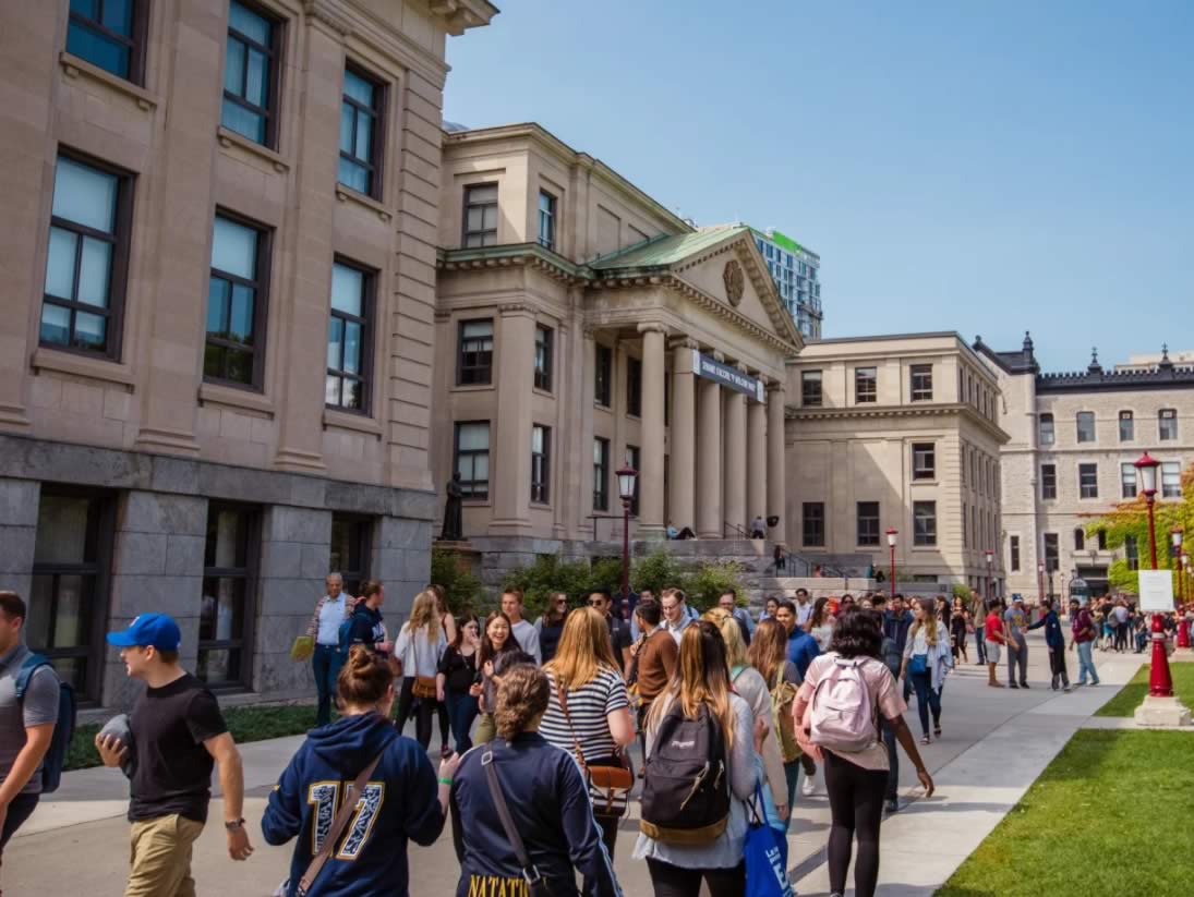 Students walking on campus on a summer day