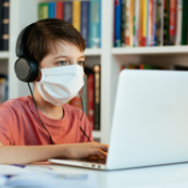 Kid in front computer
