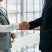 two people shake hands