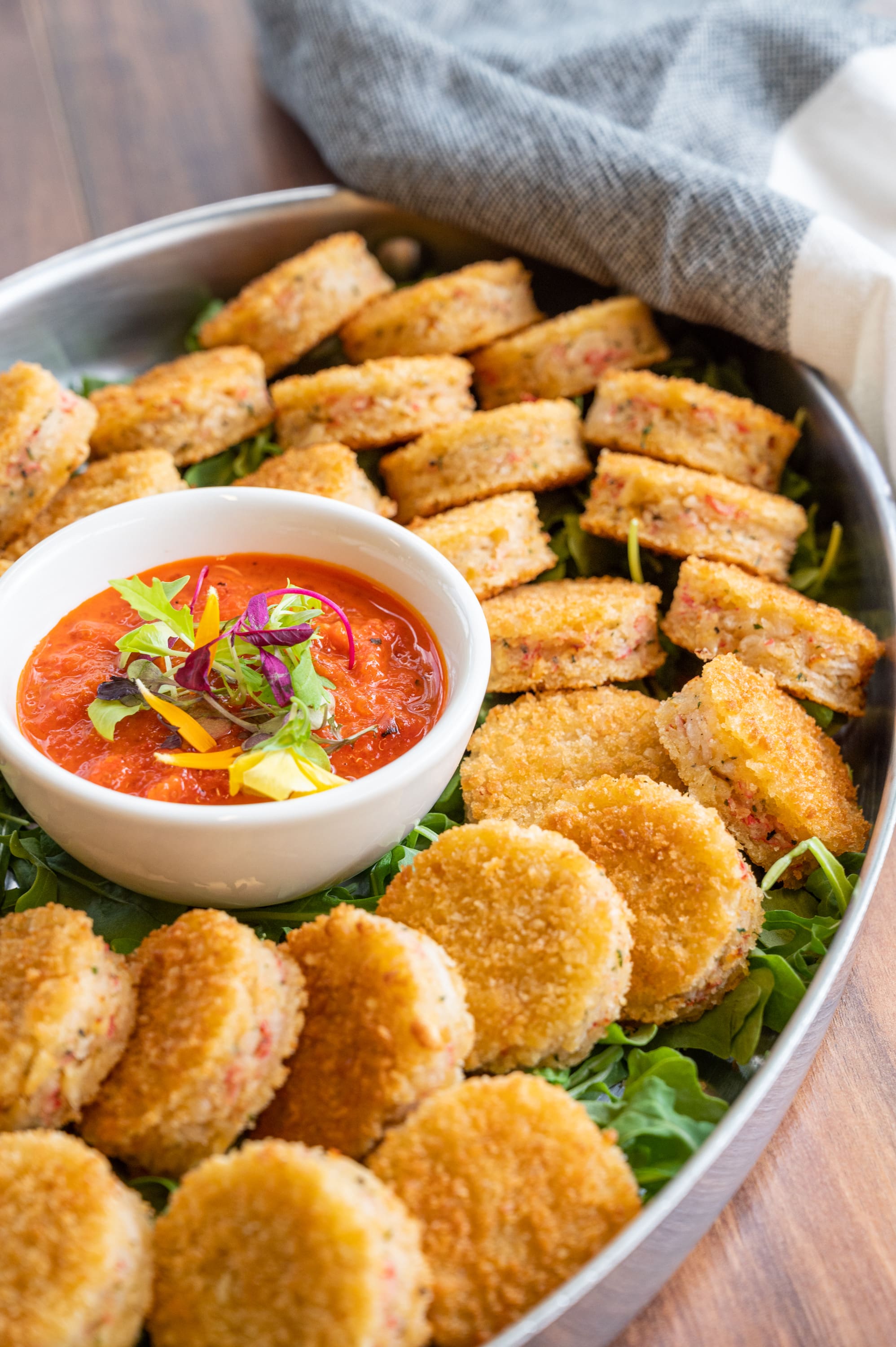 Plate of mini crab cakes with red pepper relish