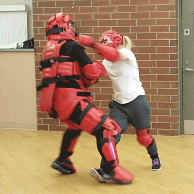 A person punching another in a self defense class