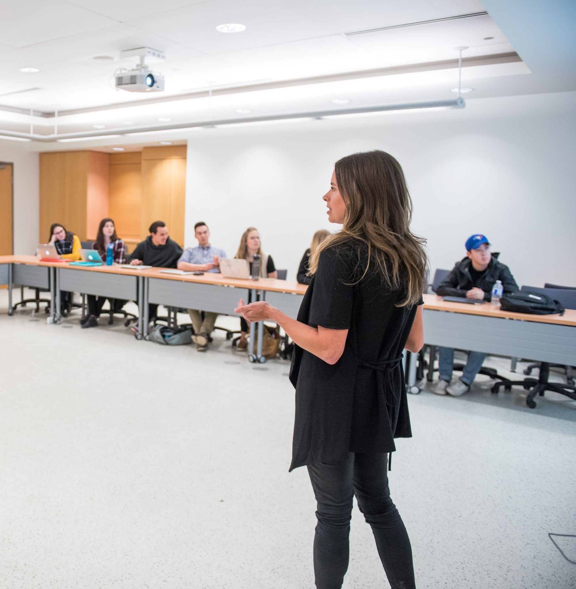 a professor interacting with her classroom