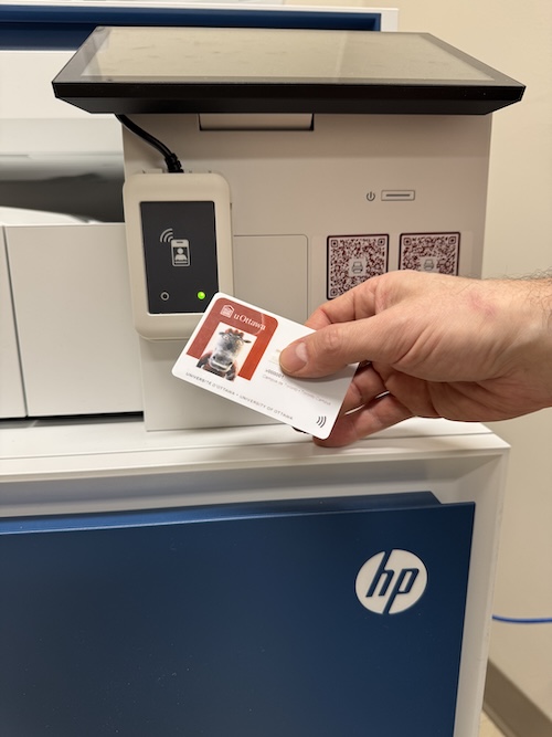 new HP public printers next to a uOttawa card