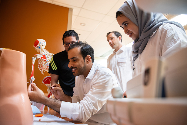 Med students looking at an object