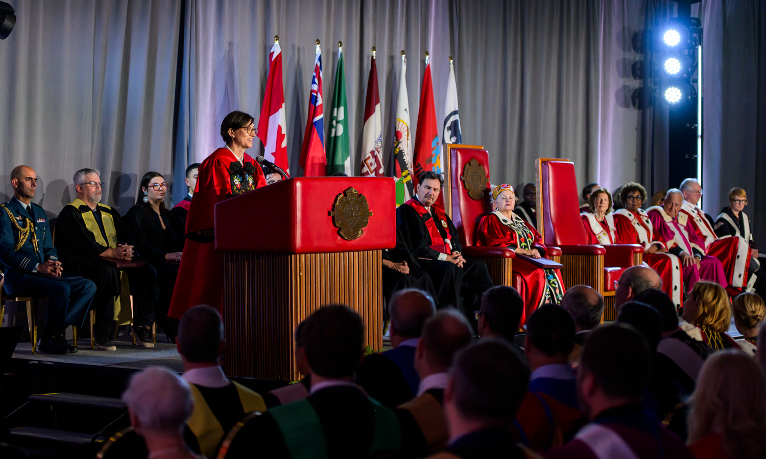 Marie-Eve Sylvestre speaking on stage at the Installation Ceremony