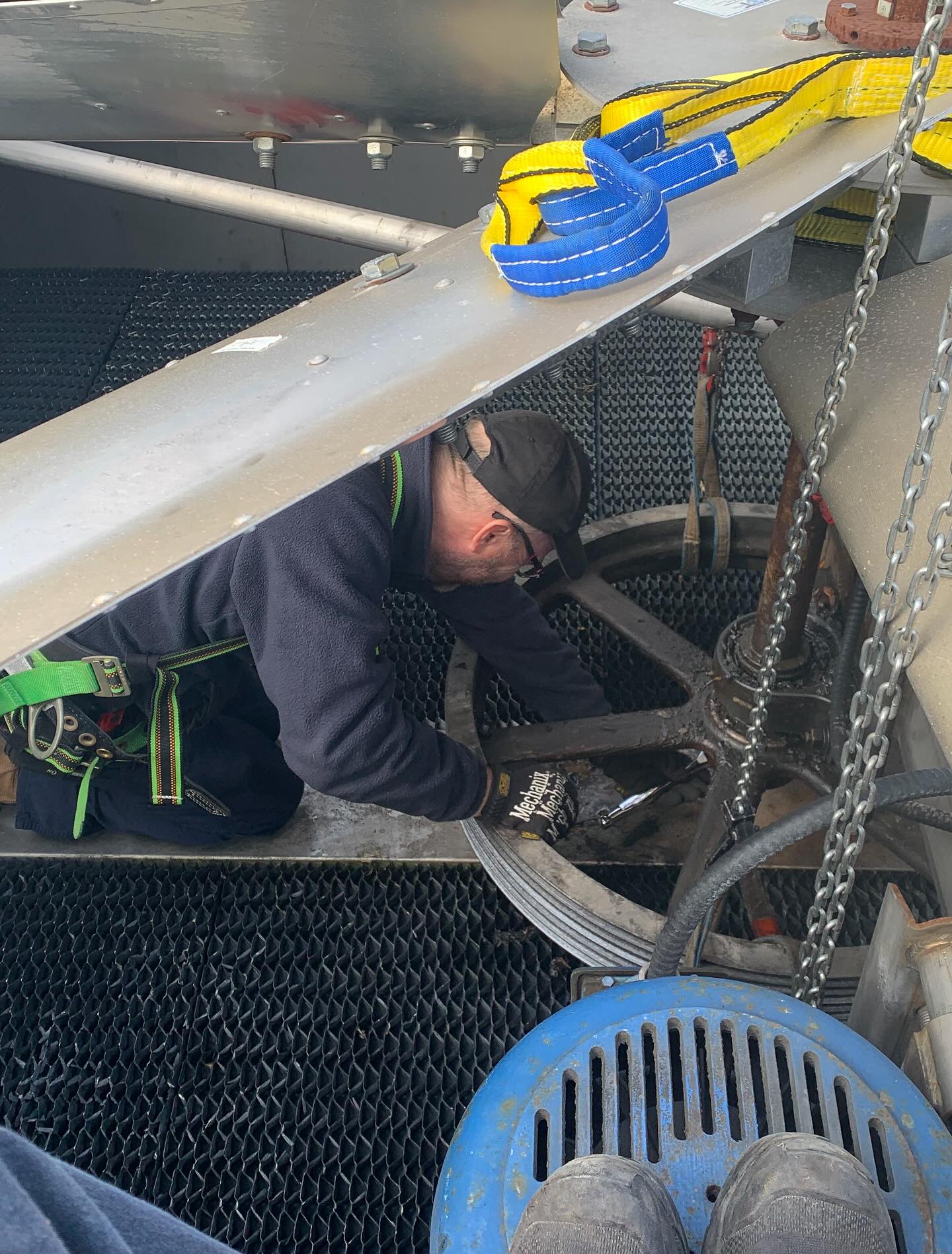 Facilities mechanic repairing a campus heating pump seal