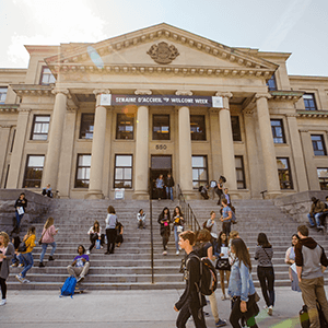 People walking in front of Tabaret Hall