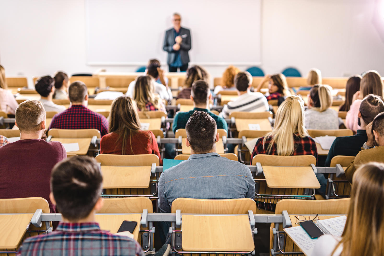 Professor speaking in front of classroom.