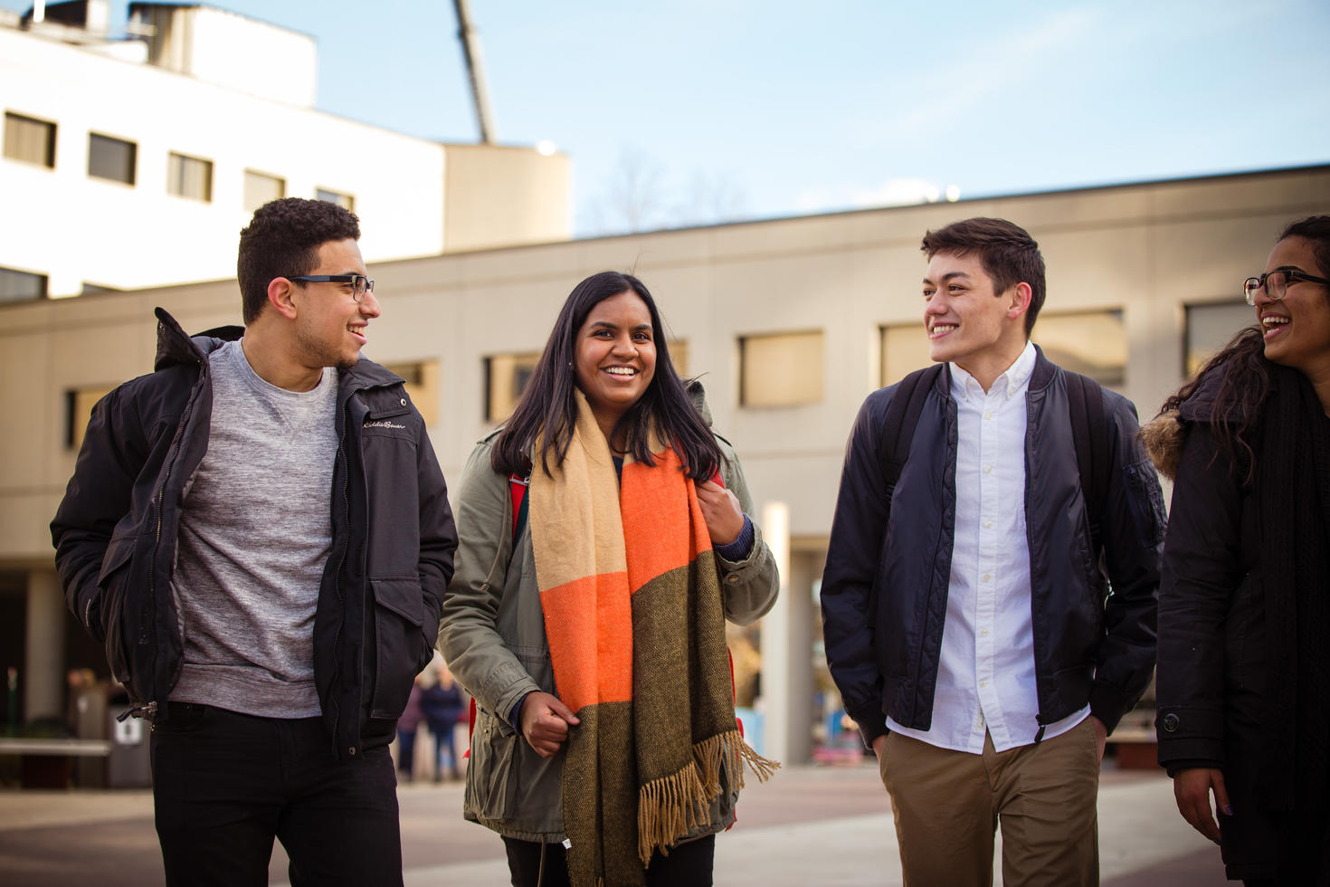Group of students walking around campus.