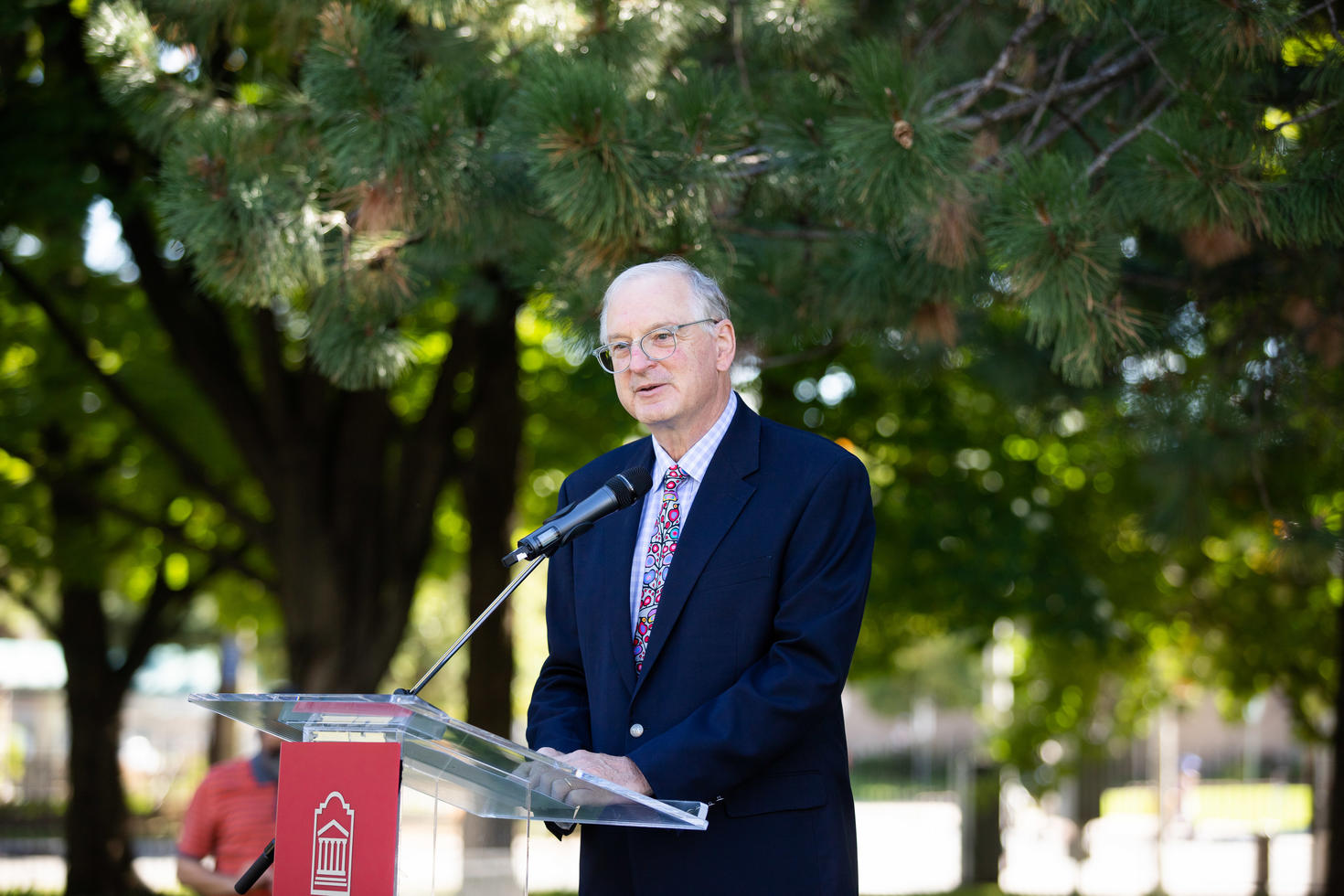 Jacques Frémont giving a speech behind a podium.