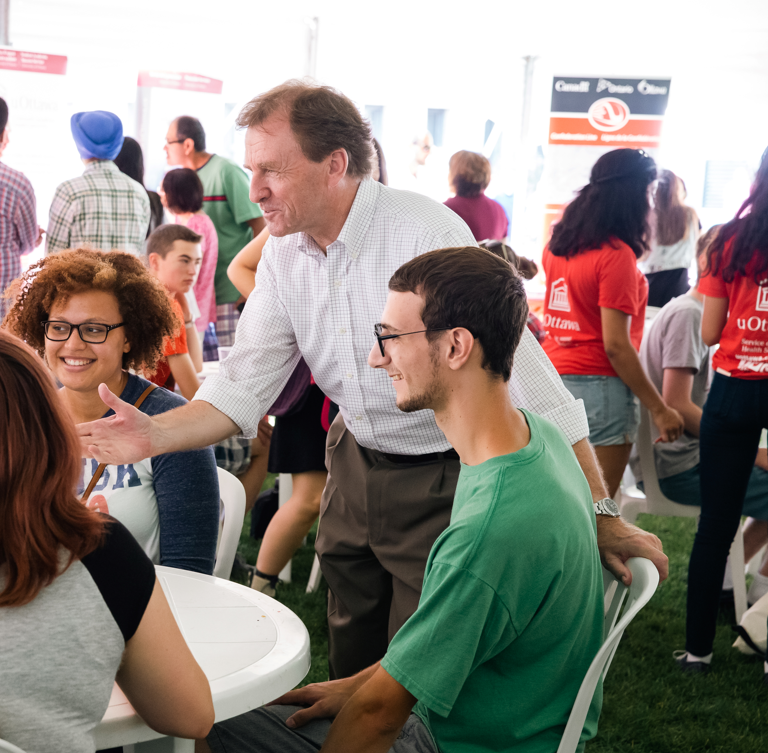 Allan Rock, past uOttawa president socializing with uOttawa community.