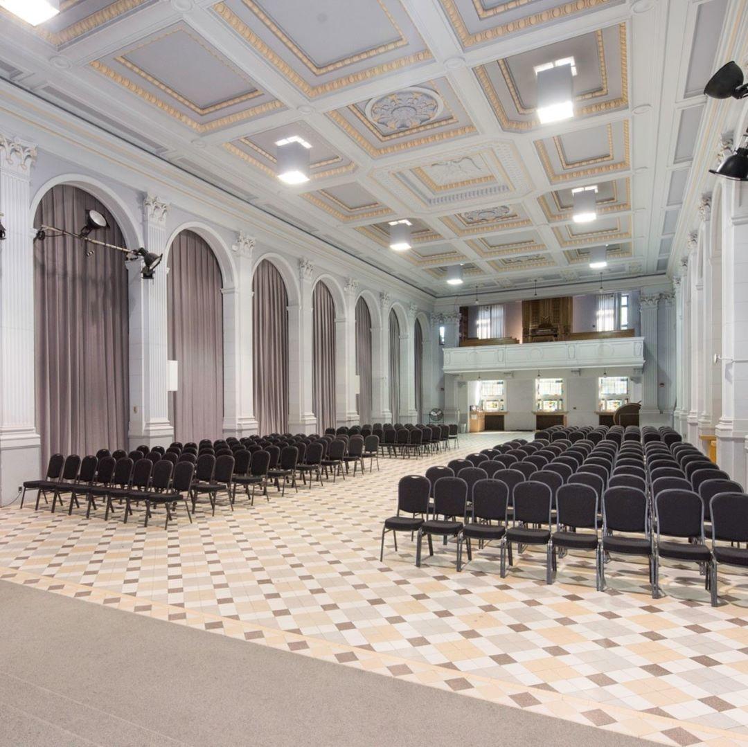 Huguette Labelle room empty with chairs set up.