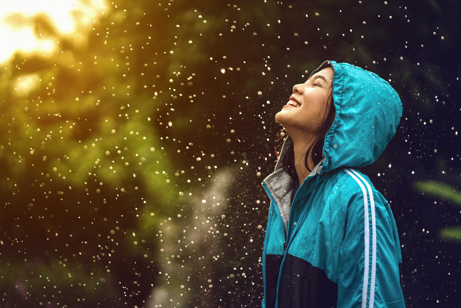 Female student looking up during a rainy day