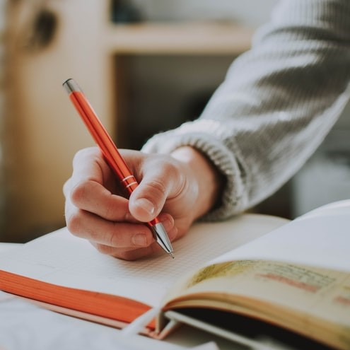 taking notes in a book