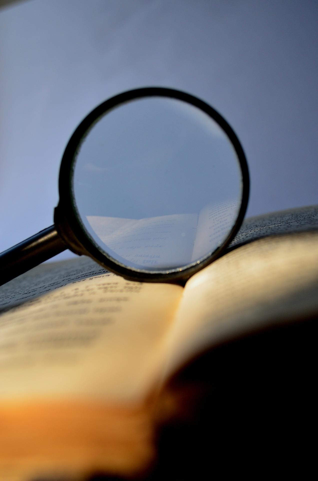 magnifiying glass held over a book