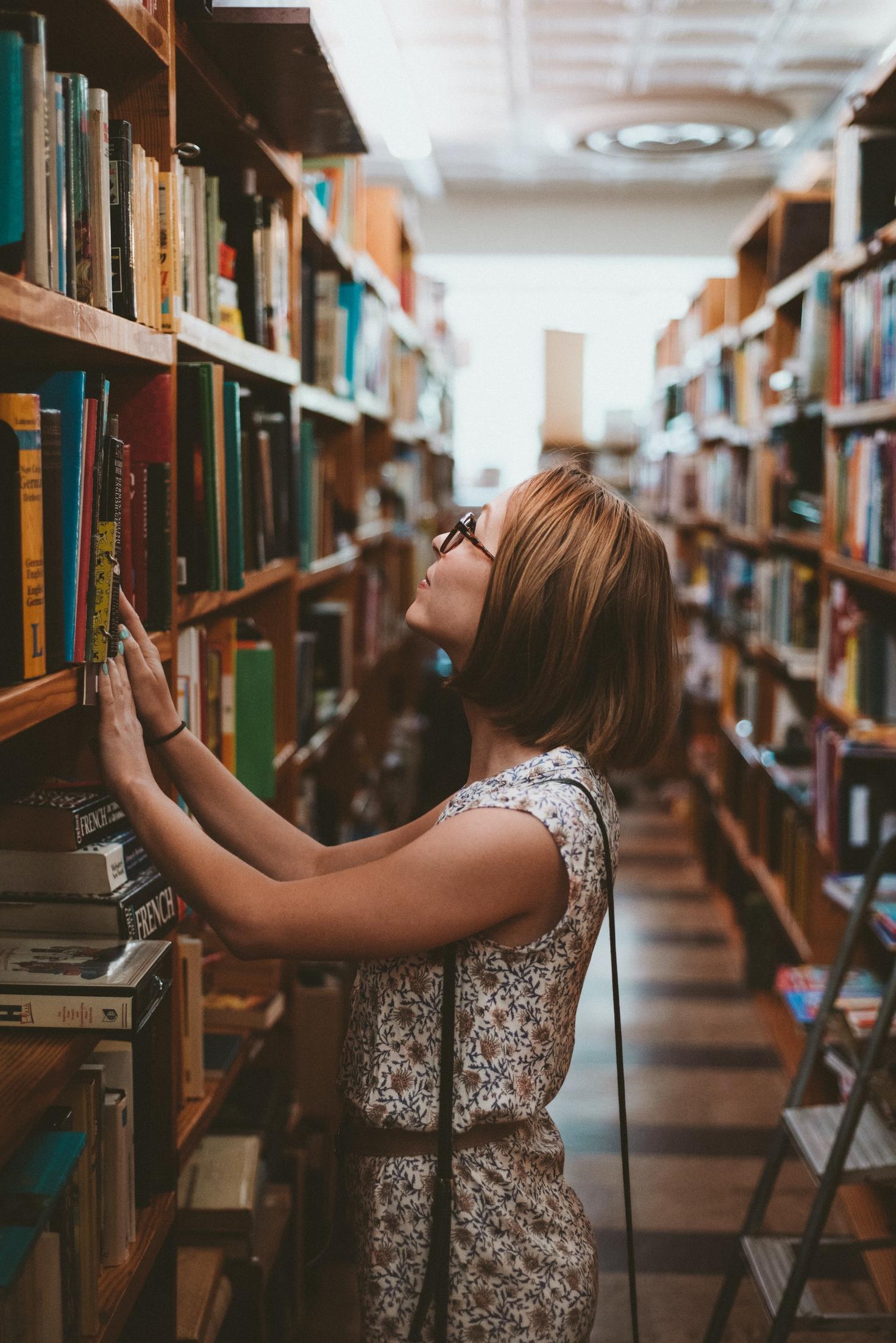 a female professor doing research in a library