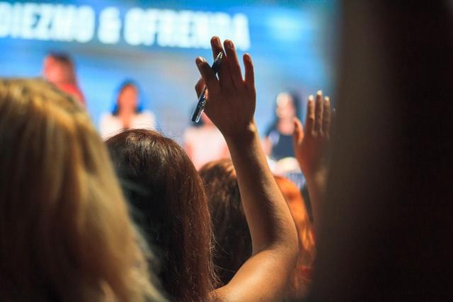 a hand raised to ask a question