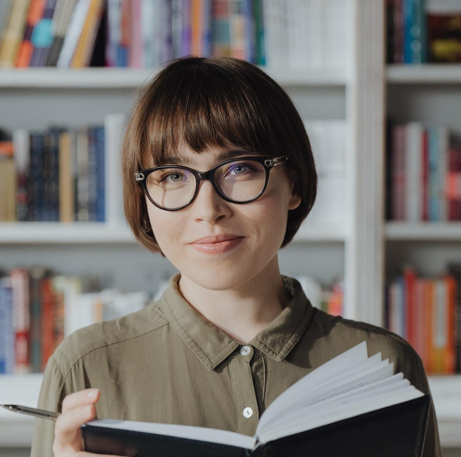 Student with a book on her hands