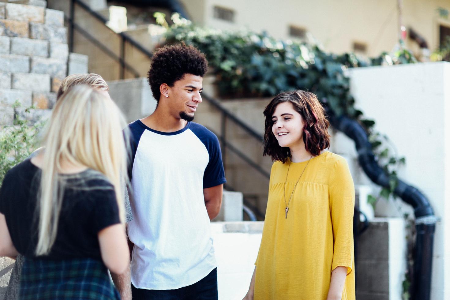 students talking on campus