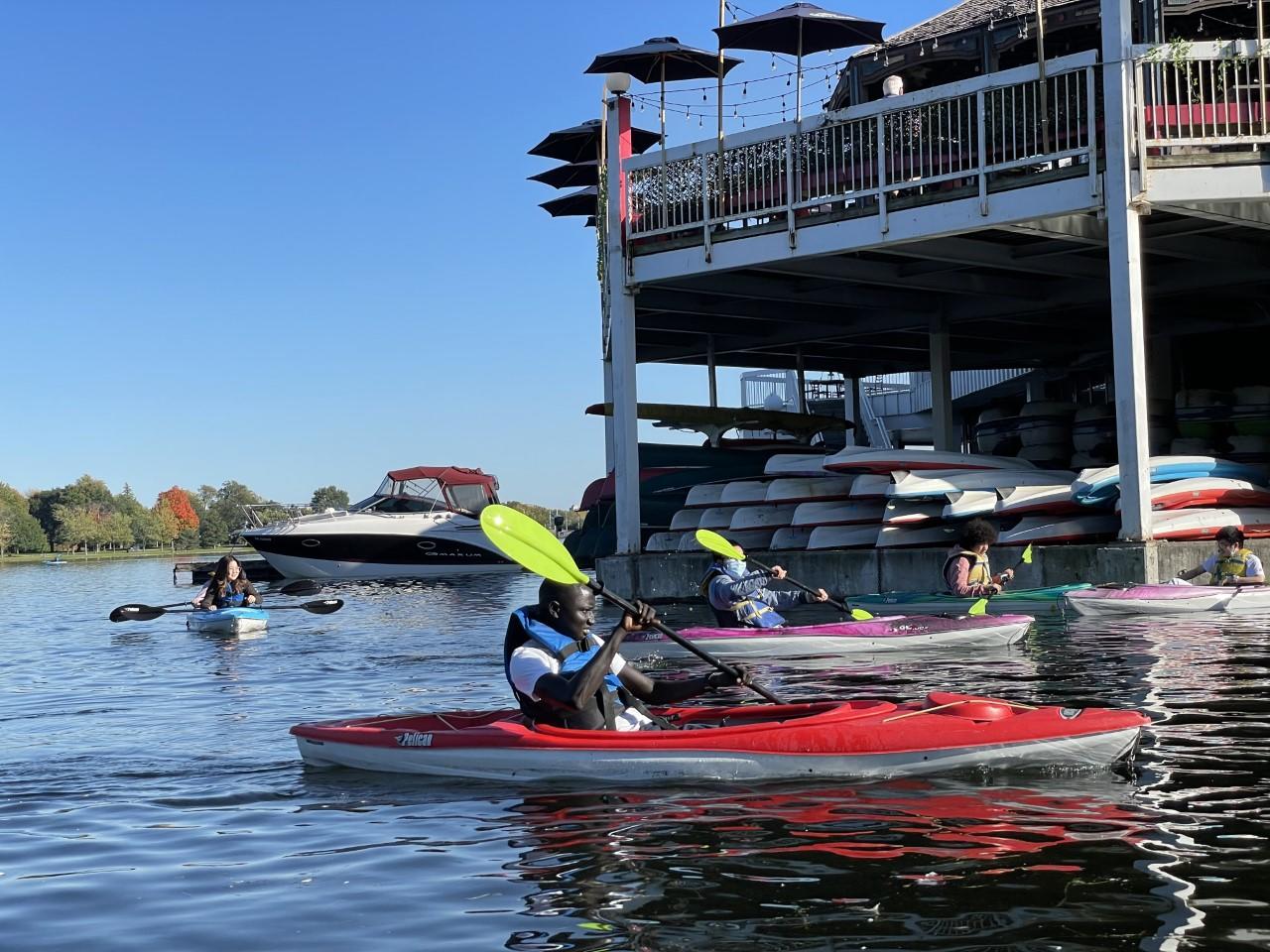 Students kayaking at a sociocultural event
