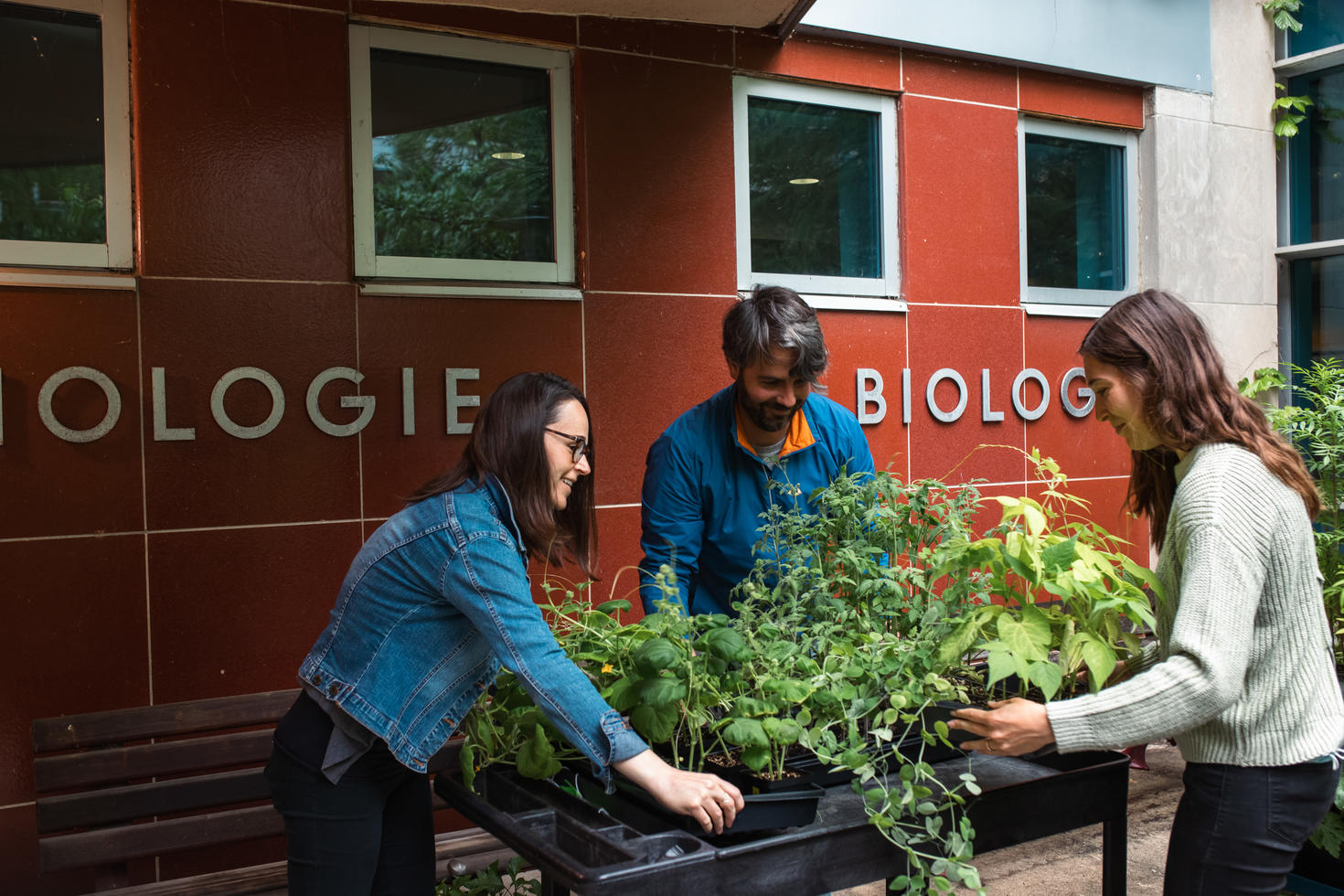 Michelle Brazeau (left) and Curtis Fowke (middle) delivering plants to community partner Holly Gordon 