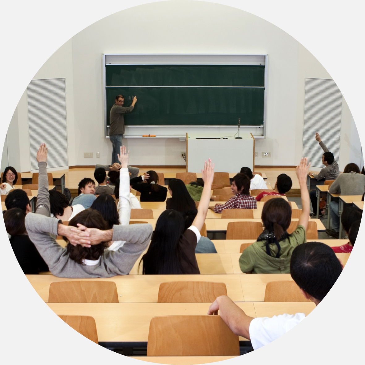 Students raising their hand in class