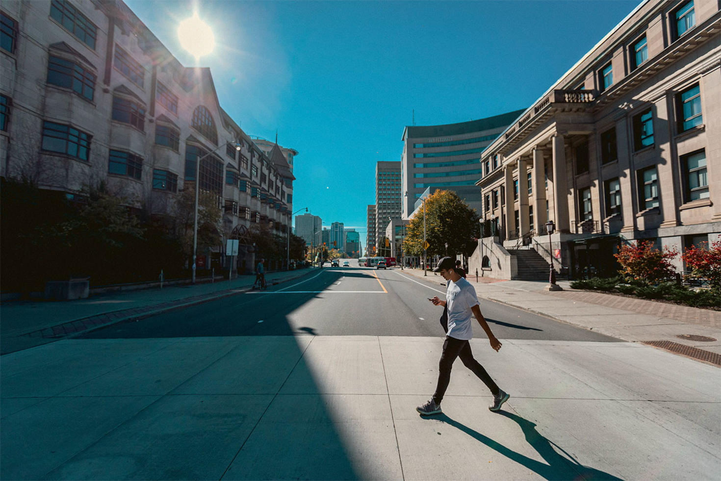 Student crossing the street on campus.