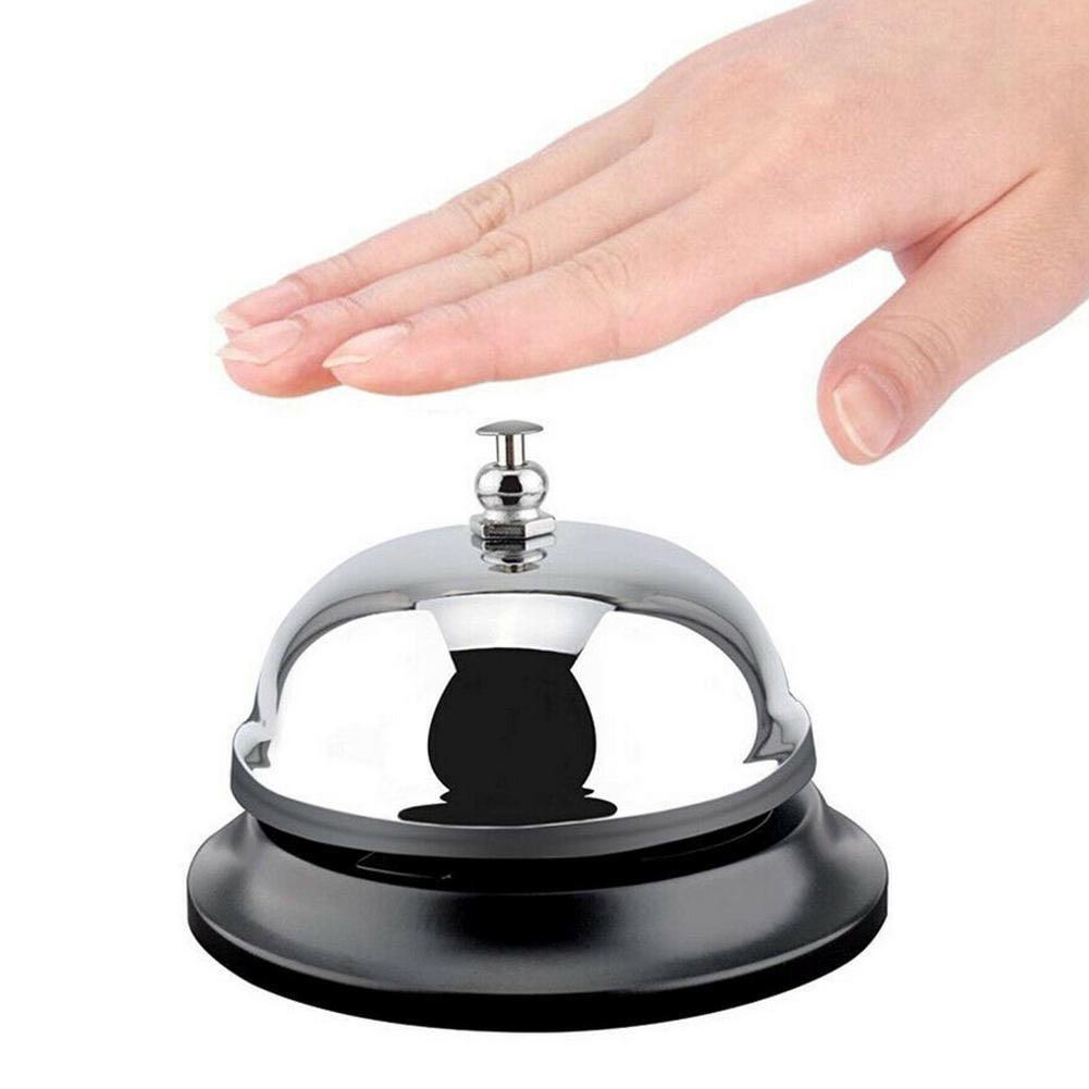 A hand pressing a bell.