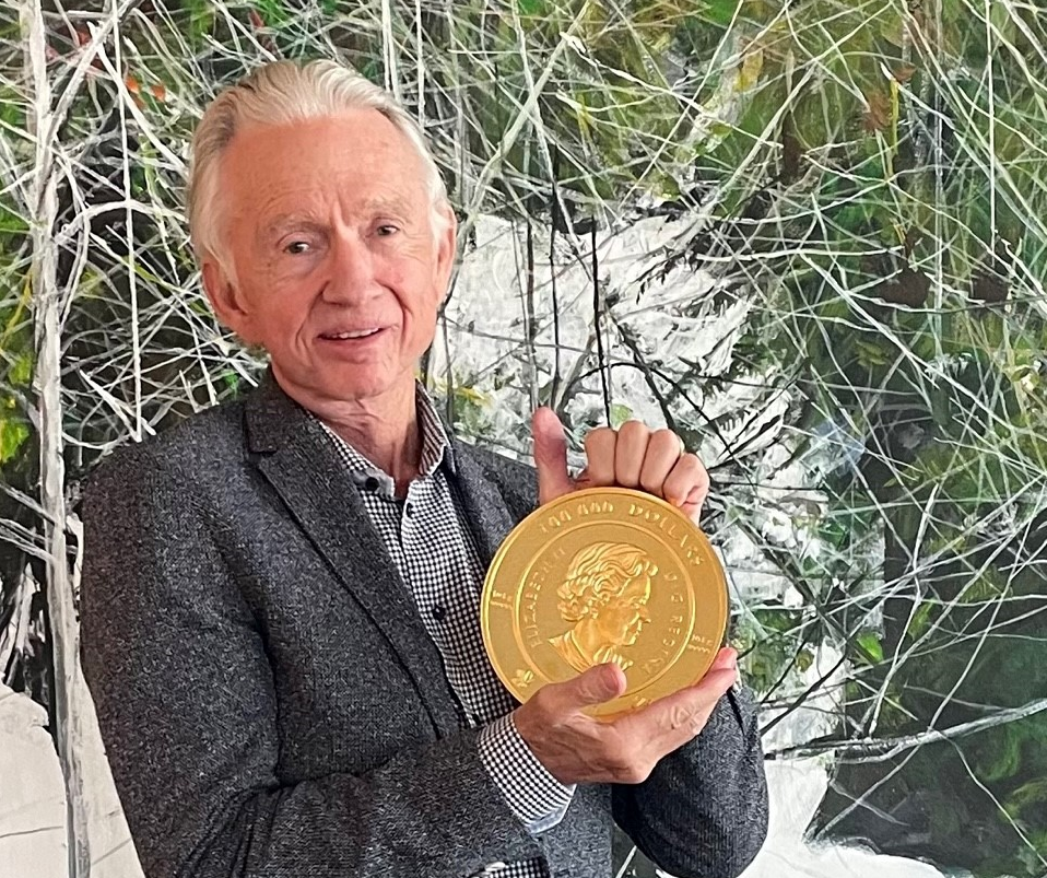 Ian Telfer holding gold coin