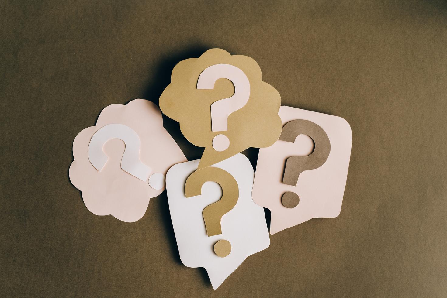 Question marks made out of cardboard.