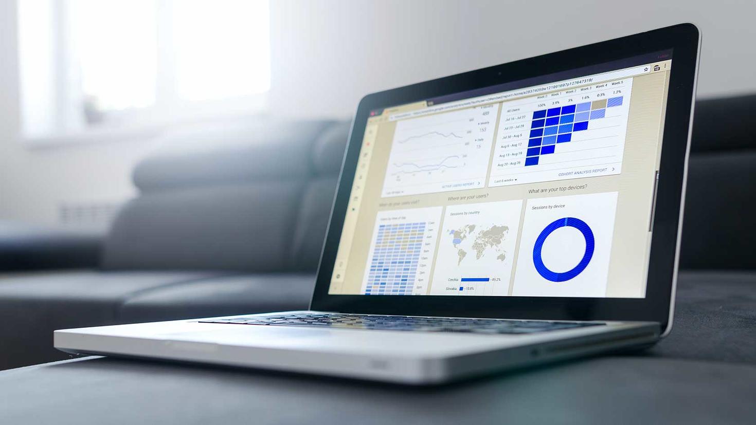 Laptop computer with a custom dashboard displayed on the screen.
