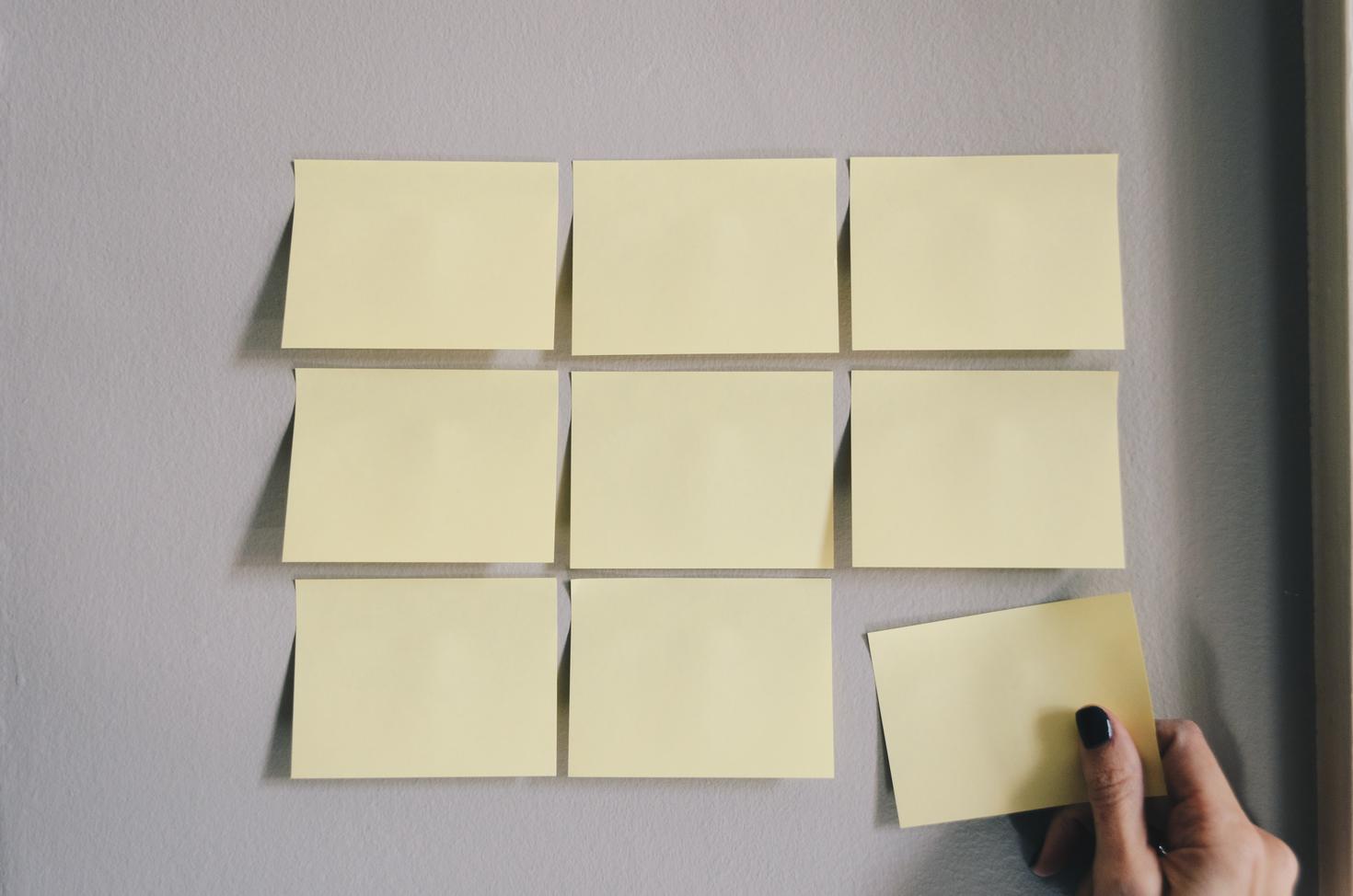 Blank post-it notes on wall.