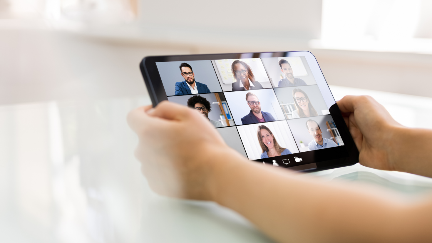 Someone attending an online lecture on a tablet