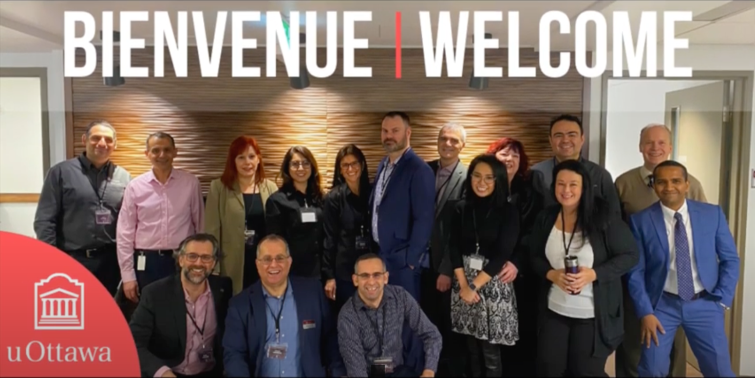 Group of employees with the word "Welcome".