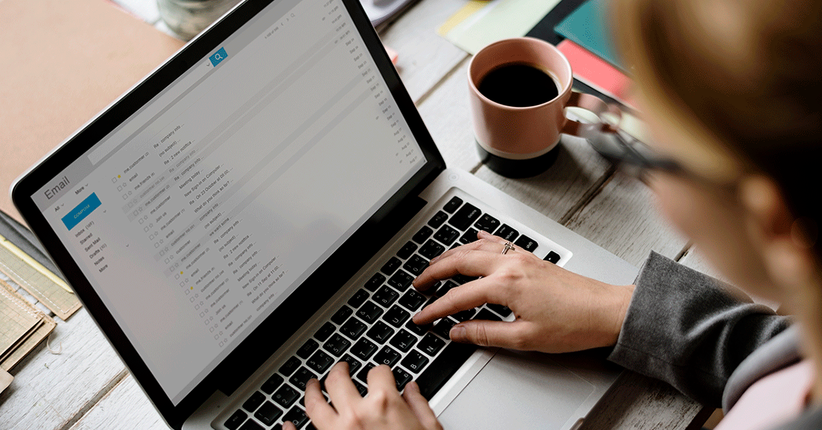 Person checking email on laptop.