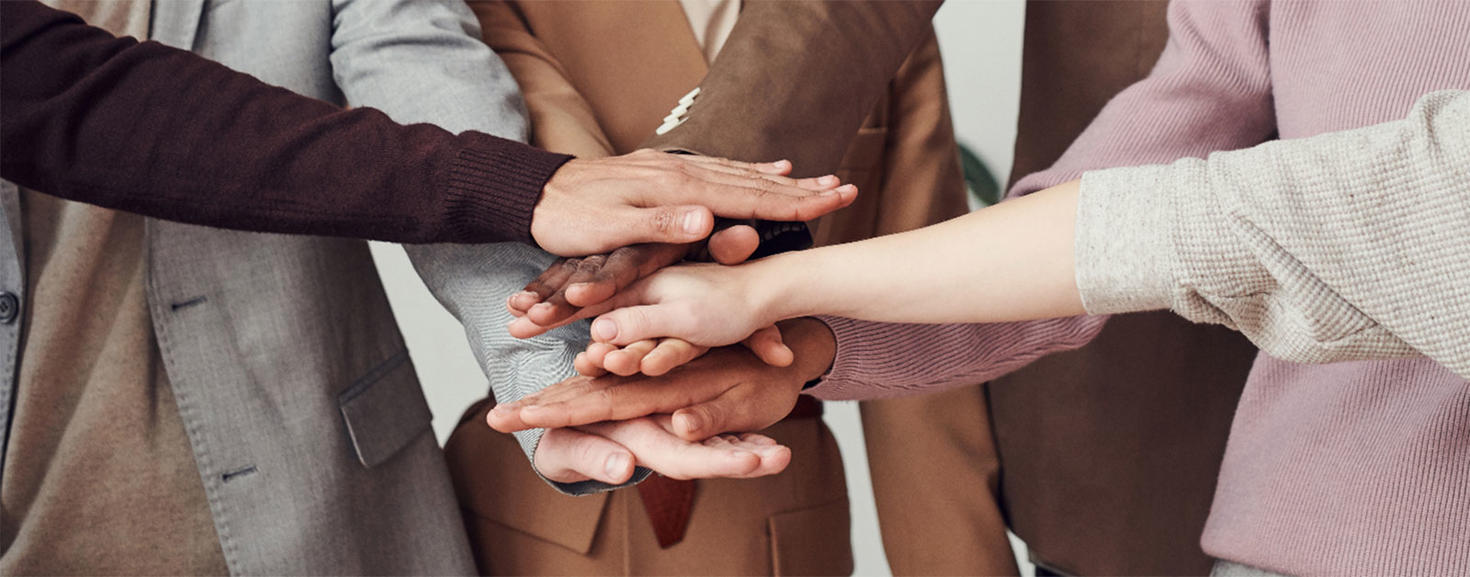 group of hands showing teamwork