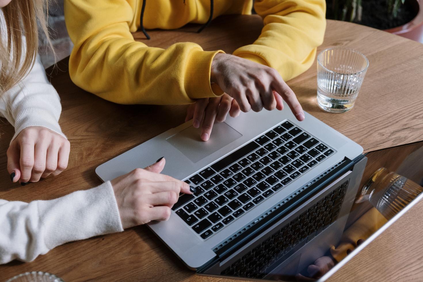 People looking at a computer