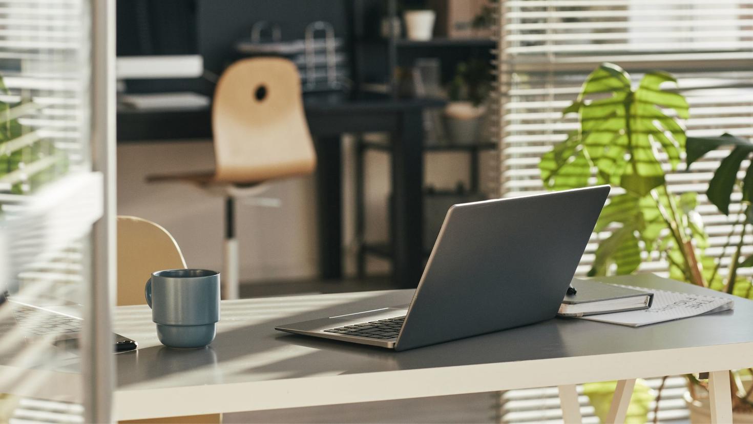 Laptop on table with mug