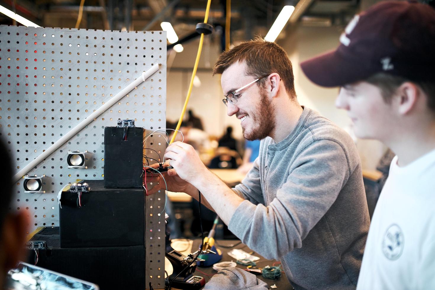 Students working on a project in an engineering design space