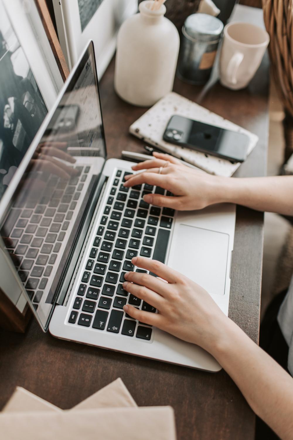 Woman typing on computer
