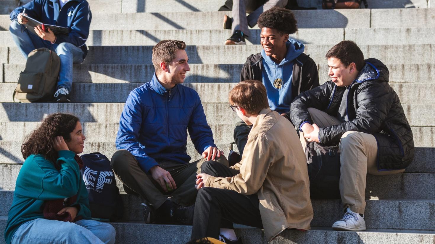 Students sitting on Tabaret stairs