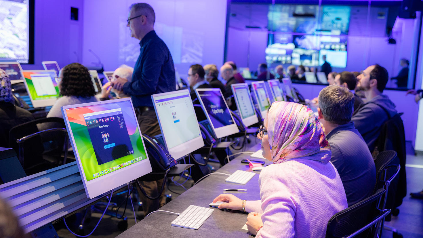 people seating in a computer room
