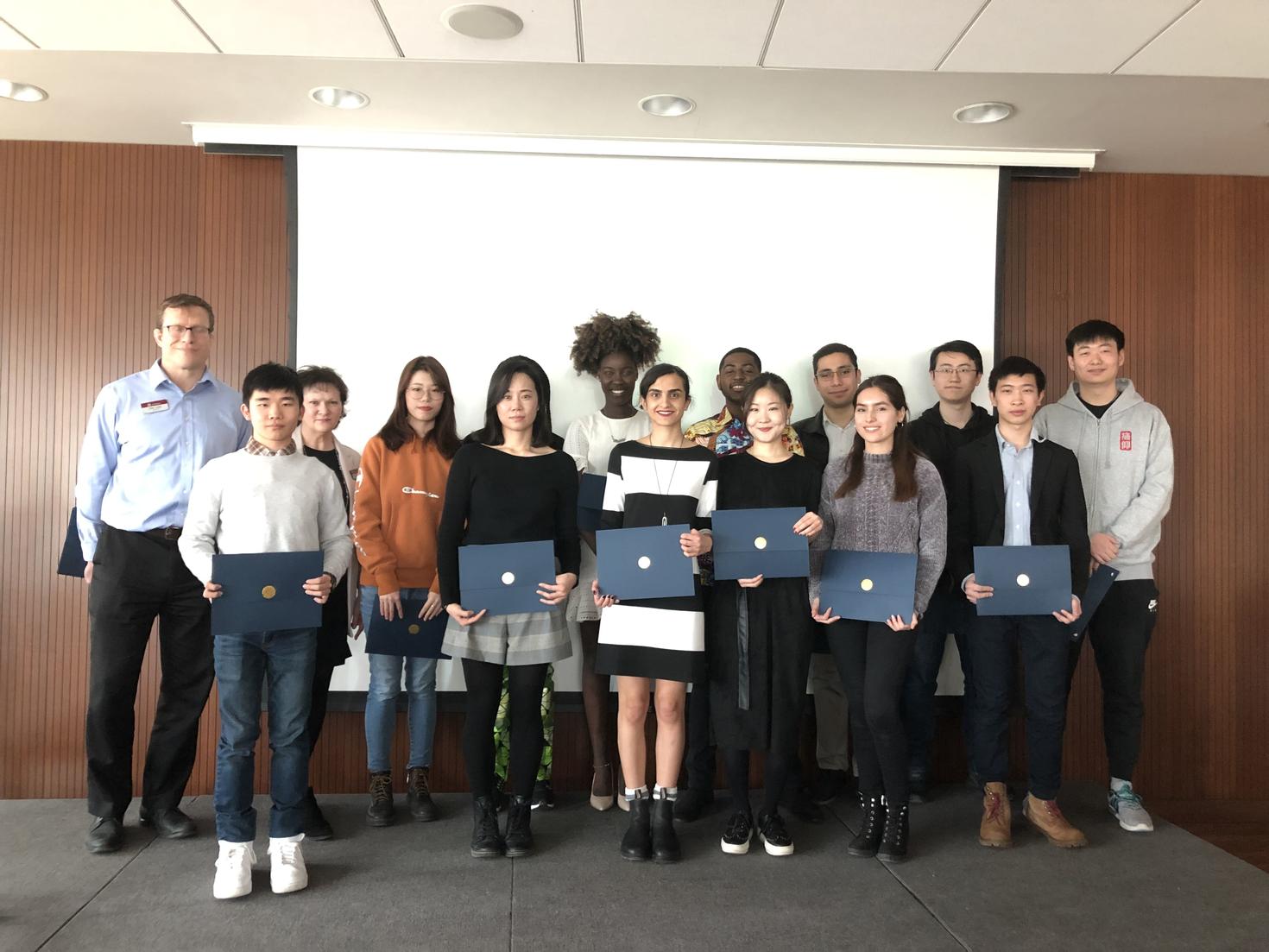 Students standing with their certificates