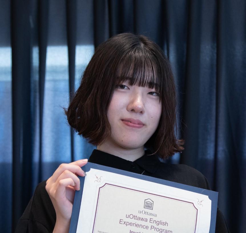 Student holding her certificate