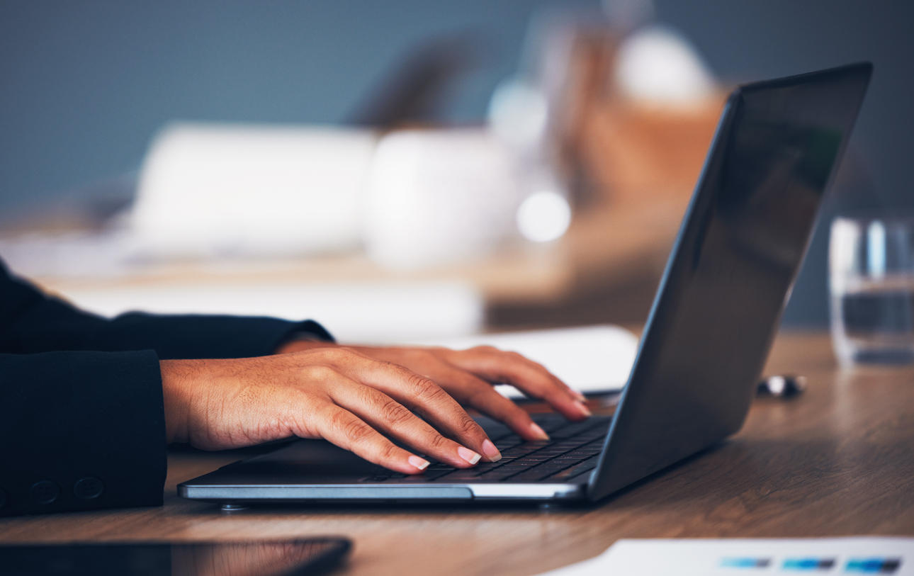 Hands on a laptop