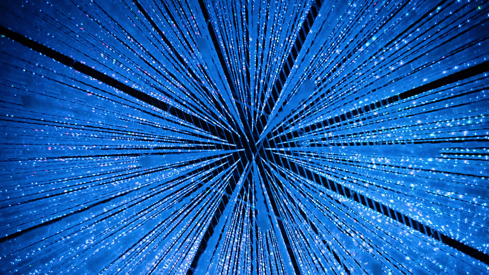 Futuristic blue lines converging on a focal point in the middle