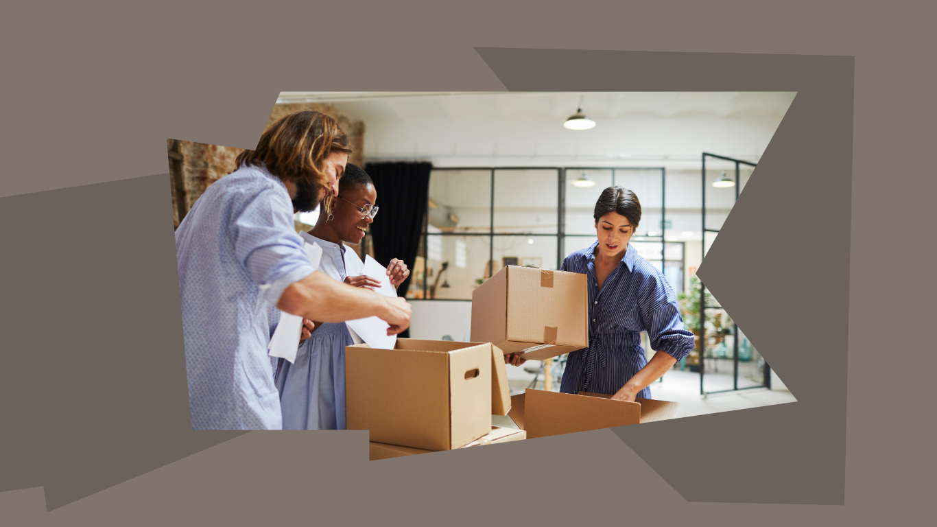Three people packing boxes.