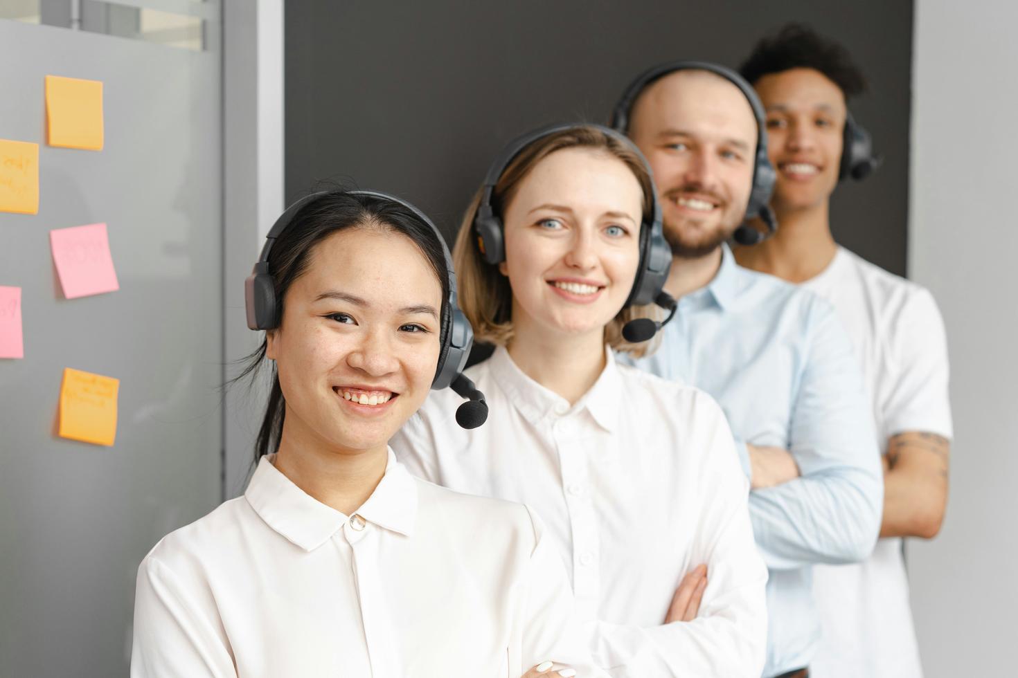 four people working in IT services
